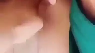 Horny girl squeezes her boobs and fingers her hairy pussy