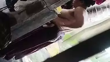 Son captures mom bathing in open backyard viral MMS